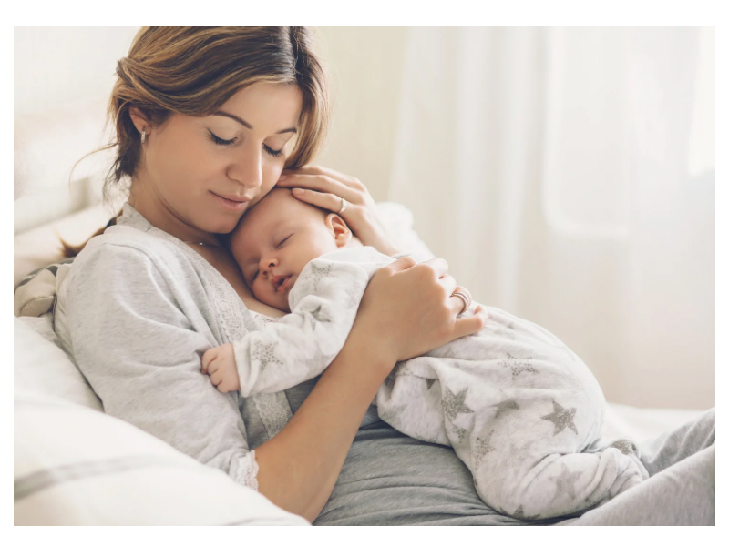 A mother praying over her child