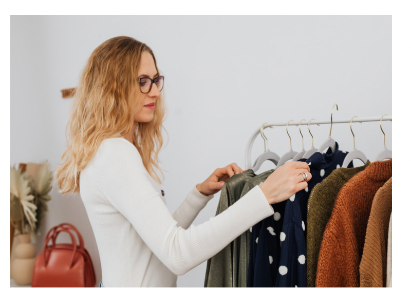 a woman putting outfits together for moms