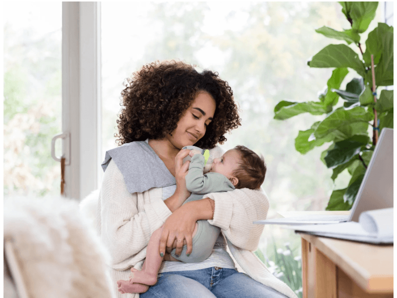a mom feeding her baby to gain weight