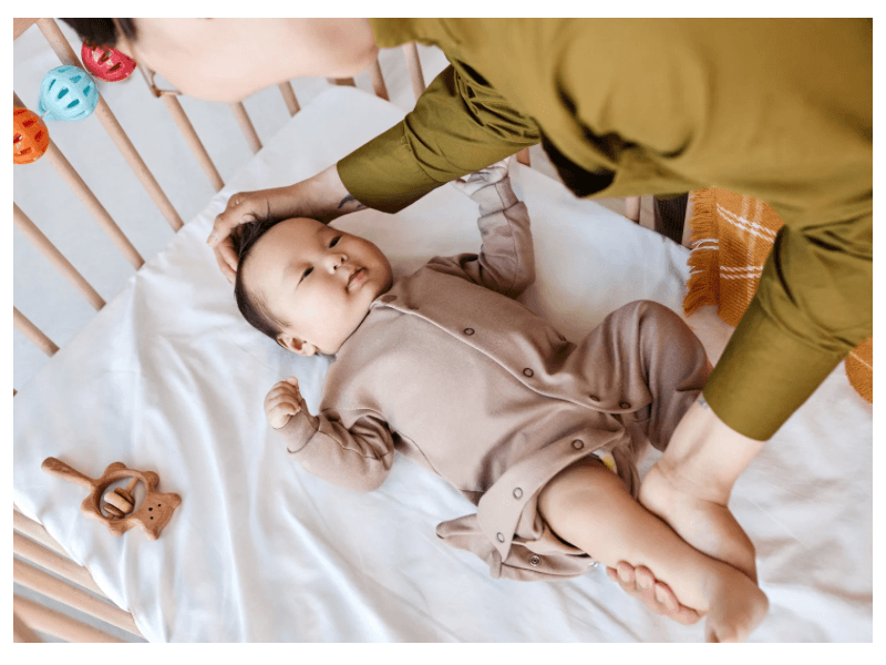 A woman trying to put baby to sleep