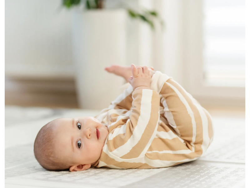 A chubby well feed baby lying down